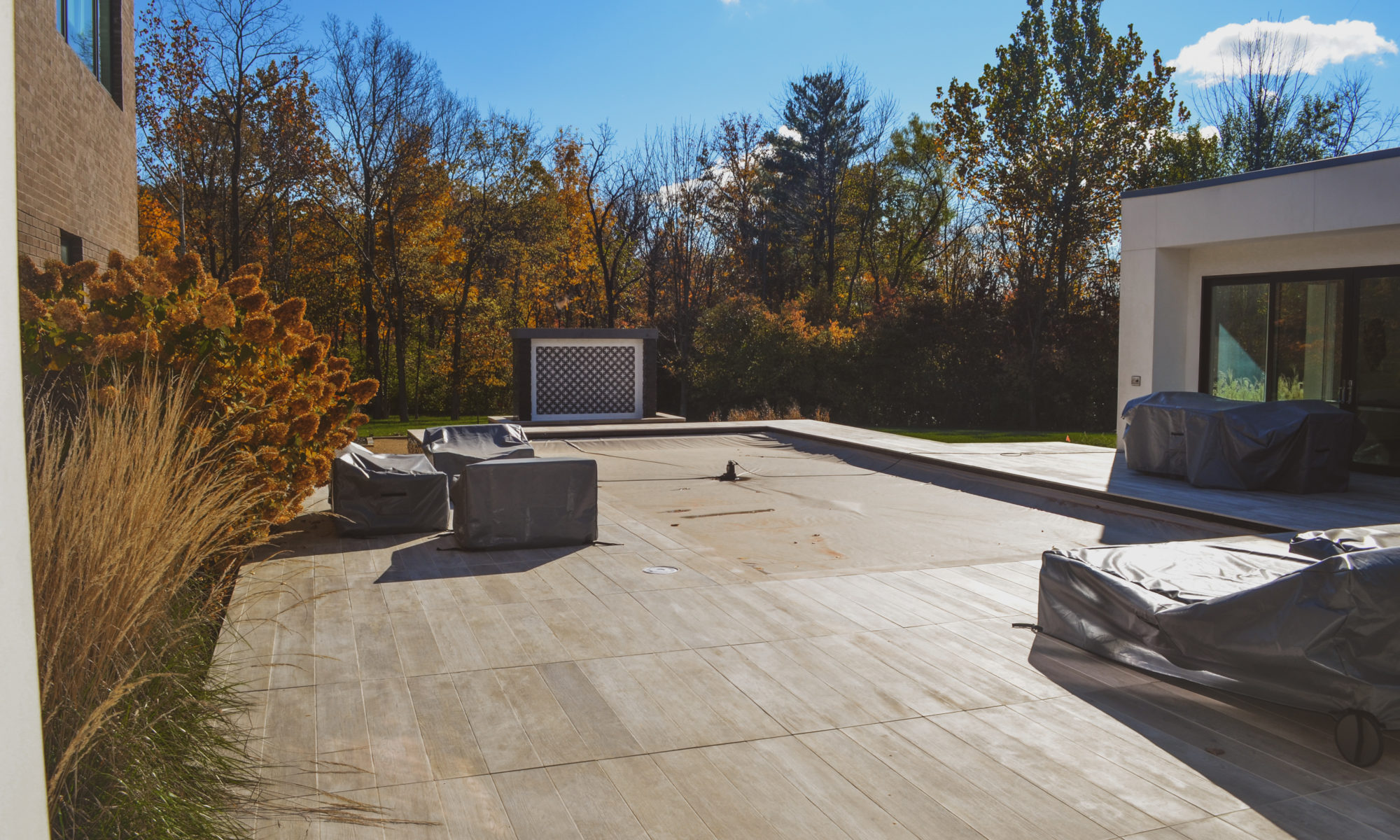 Precision Outdoors Carmel Art Silo Deck custom water feature outdoor living by Belgard noon tile pool deck custom landscaping Carmel indiana dream backyard goals