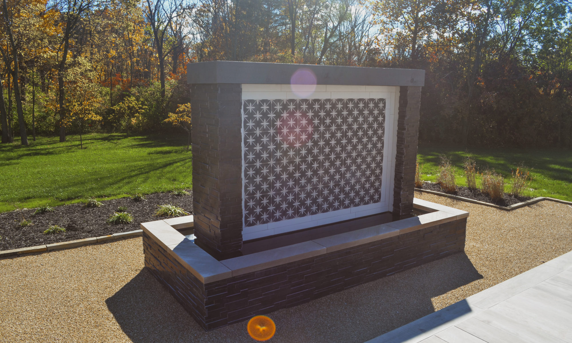 Precision Outdoors Carmel Art Silo Deck custom water feature outdoor living by Belgard noon tile pool deck custom landscaping Carmel indiana dream backyard goals