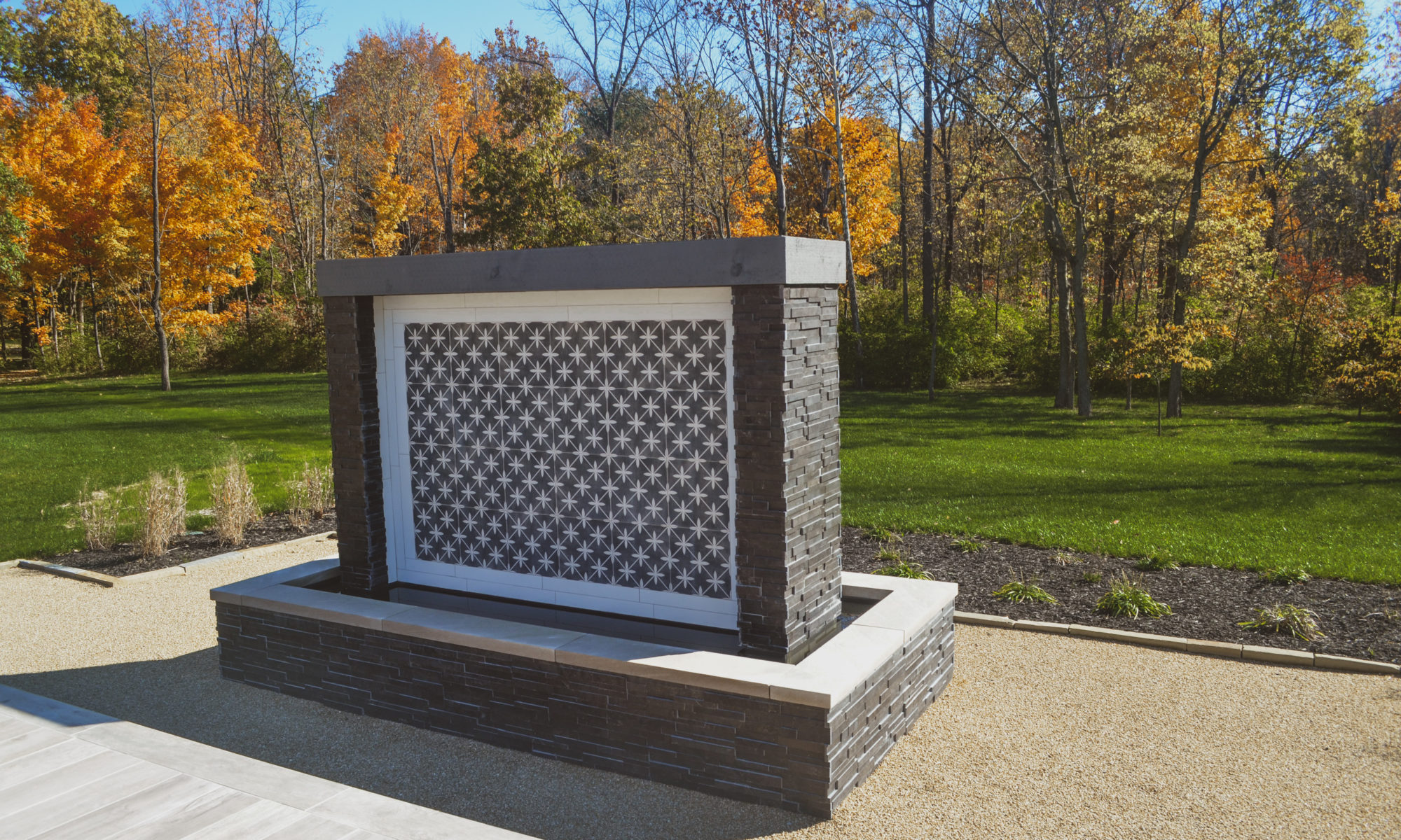 Precision Outdoors Carmel Art Silo Deck custom water feature outdoor living by Belgard noon tile pool deck custom landscaping Carmel indiana dream backyard goals