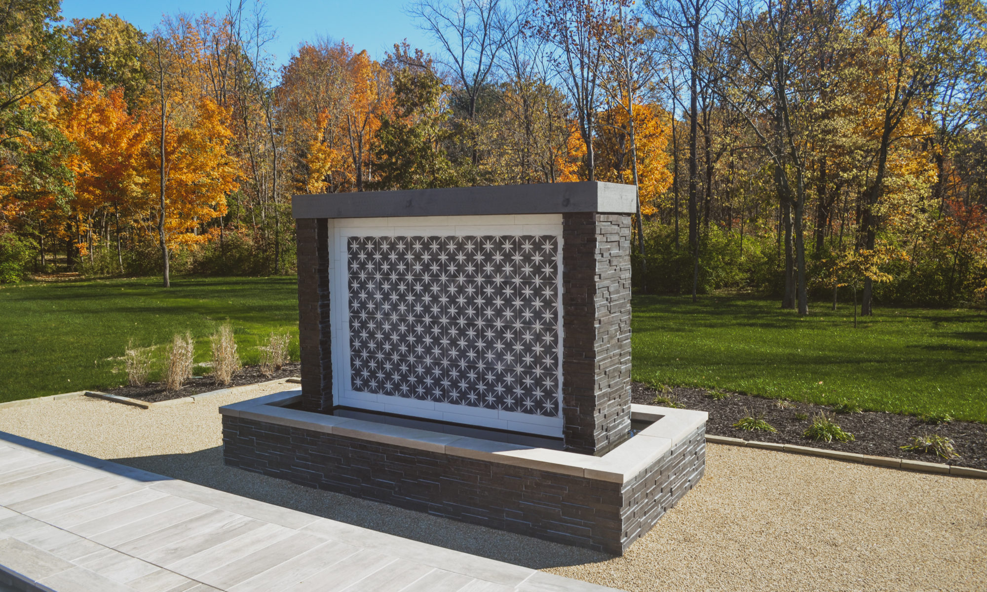Precision Outdoors Carmel Art Silo Deck custom water feature outdoor living by Belgard noon tile pool deck custom landscaping Carmel indiana dream backyard goals