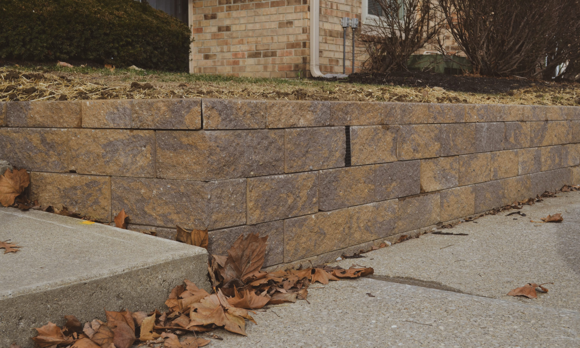 Precision Outdoors Mission Hills Apartments Gable Roof Structure Linear gas firepit paver patio seating wall Carmel indiana curb appeal