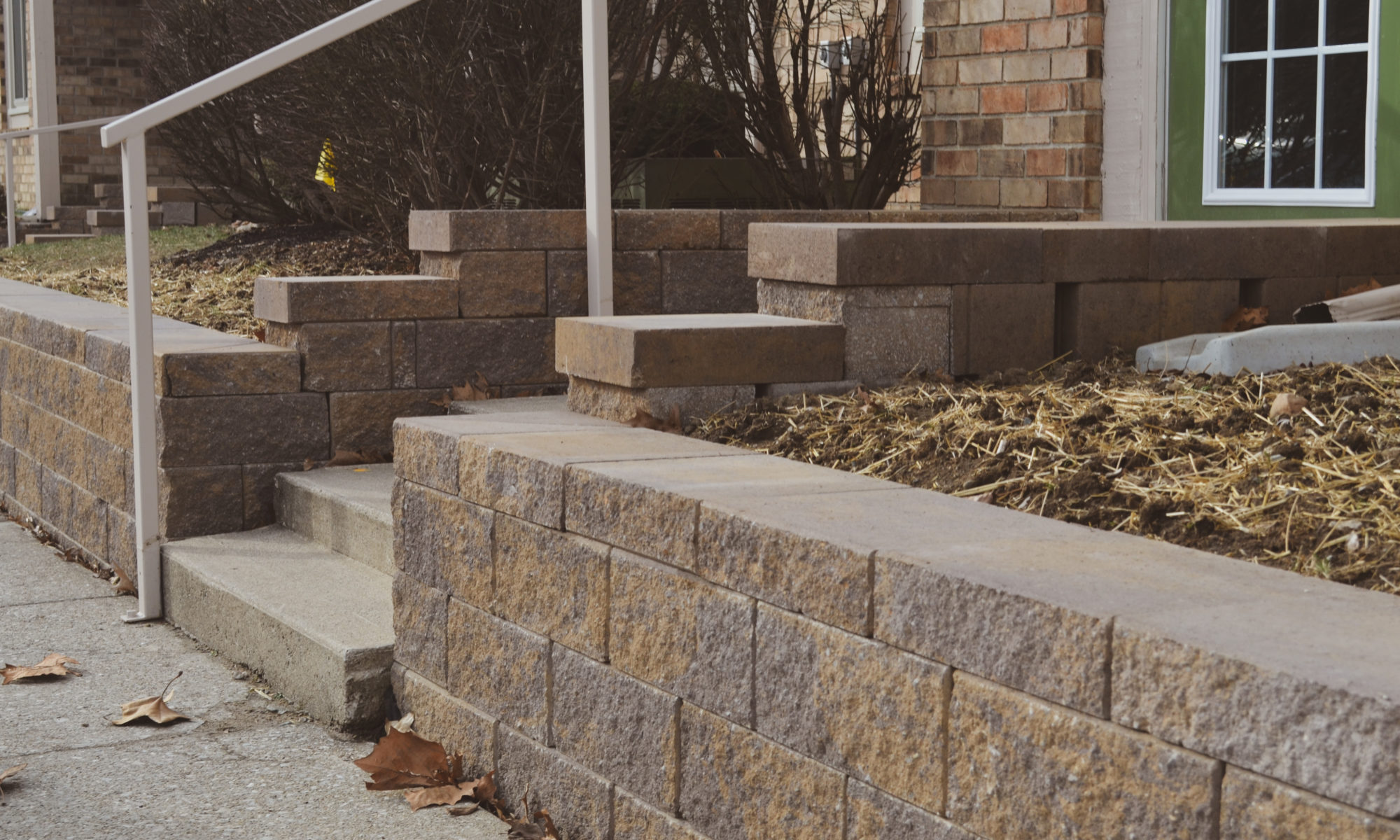 Precision Outdoors Mission Hills Apartments Gable Roof Structure Linear gas firepit paver patio seating wall Carmel indiana curb appeal