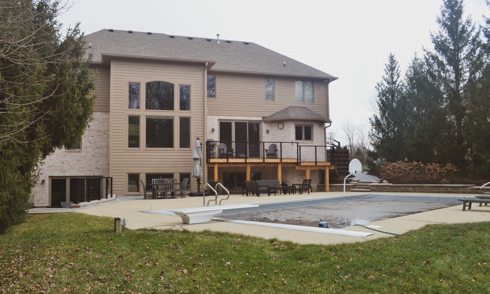 Precision Outdoors Sunken Paver Patio raised deck retaining wall terraced landscaping beds Zionsville indiana beautiful backyard