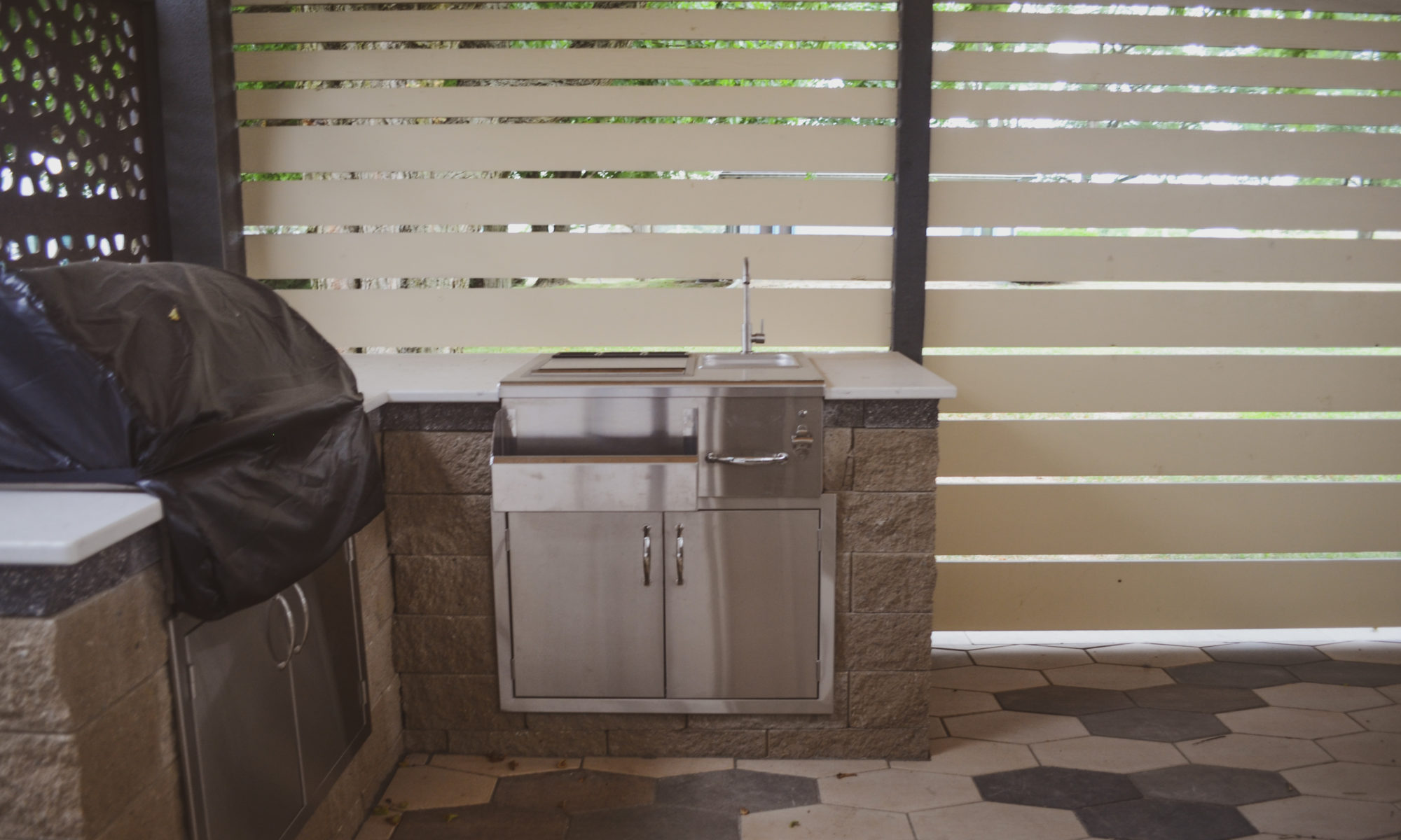 Precision outdoors sophisticated commercial property paver patio modern step walkway cable railing large outdoor dining space outdoor kitchen sink grill miniature refrigerator mini fridge extra seating bar decorative sunscreen sunscreens indianapolis indiana