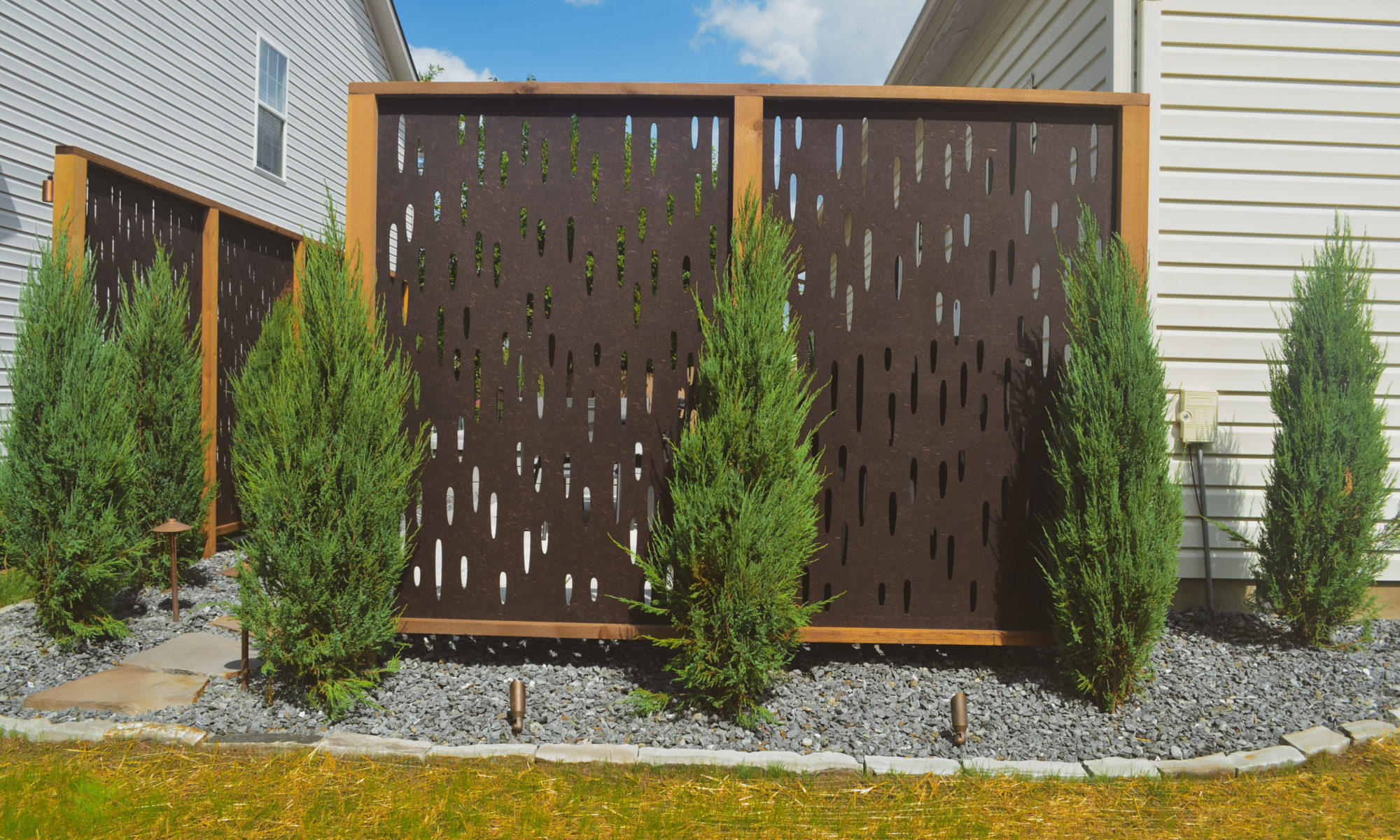 The Private Plaza privacy screens custom landscaping fire pit arborvitae private dining privacy Carmel indiana landscaping walkway