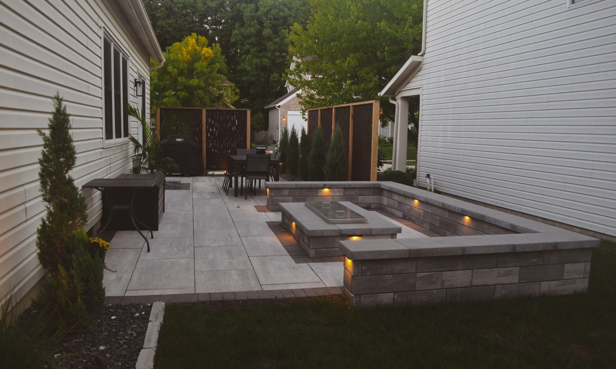 The Private Plaza privacy screens custom landscaping fire pit arborvitae private dining privacy Carmel indiana landscaping walkway Night Lighting