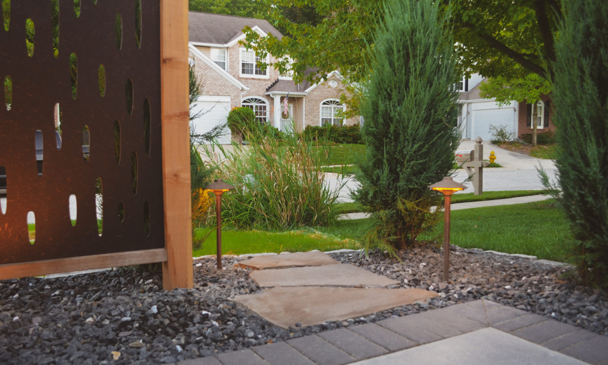 The Private Plaza privacy screens custom landscaping fire pit arborvitae private dining privacy Carmel indiana landscaping walkway Night Lighting