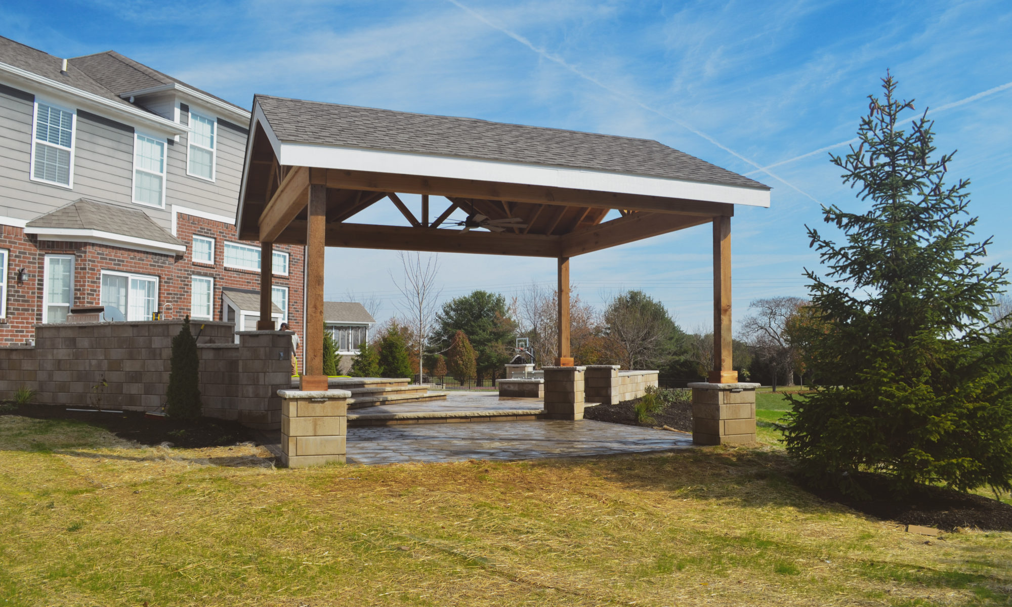 Gables at Hickory Stick Greenwood Bargersville Indiana Paver Patio Gas burning fire pit exterior build dream backyard gable roof structure walkway custom custom landscaping outdoor kitchen mini fridge mini refrigerator fan lighting grill