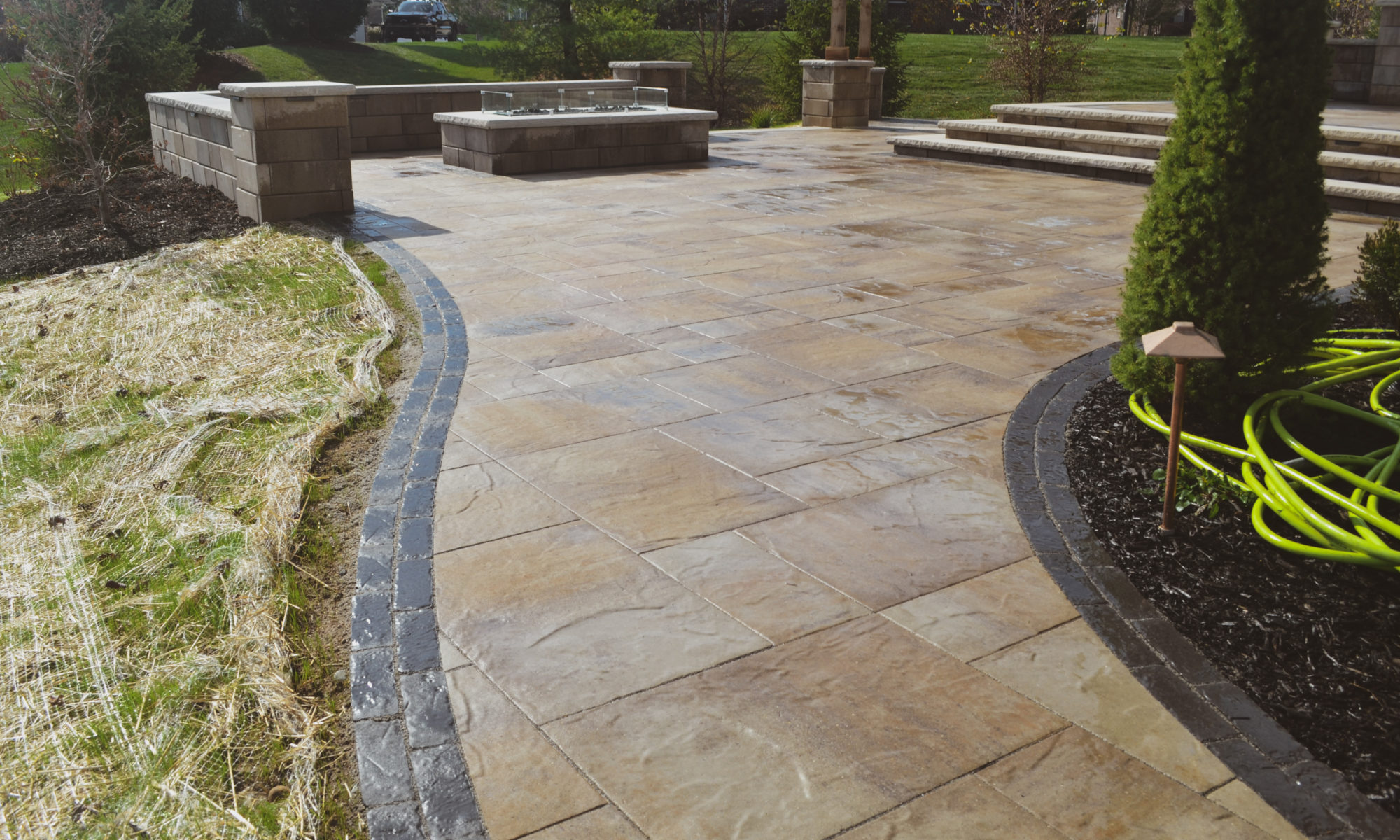 Gables at Hickory Stick Greenwood Bargersville Indiana Paver Patio Gas burning fire pit exterior build dream backyard gable roof structure walkway custom custom landscaping outdoor kitchen mini fridge mini refrigerator fan lighting grill