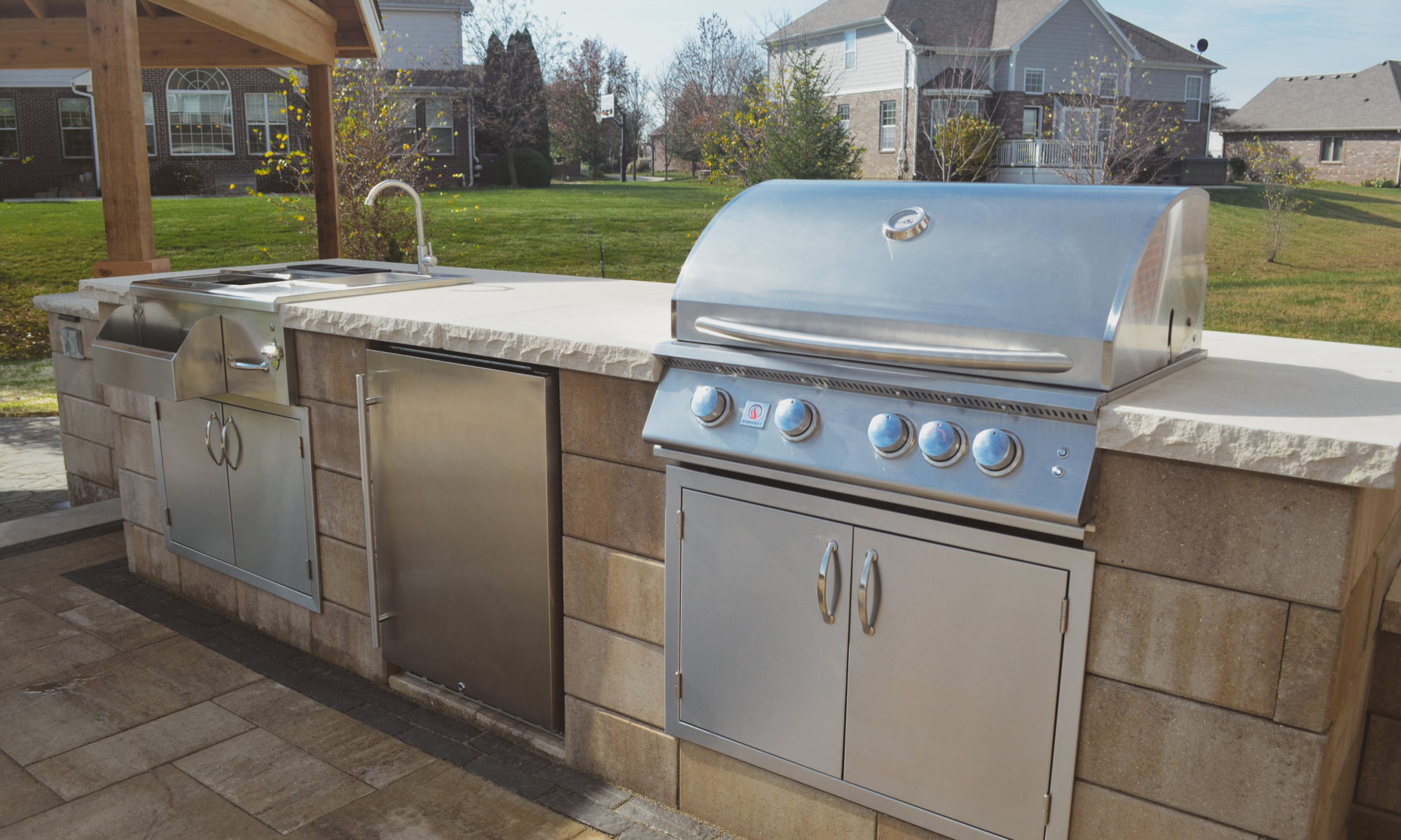 Gables at Hickory Stick Greenwood Bargersville Indiana Paver Patio Gas burning fire pit exterior build dream backyard gable roof structure walkway custom custom landscaping outdoor kitchen mini fridge mini refrigerator fan lighting grill