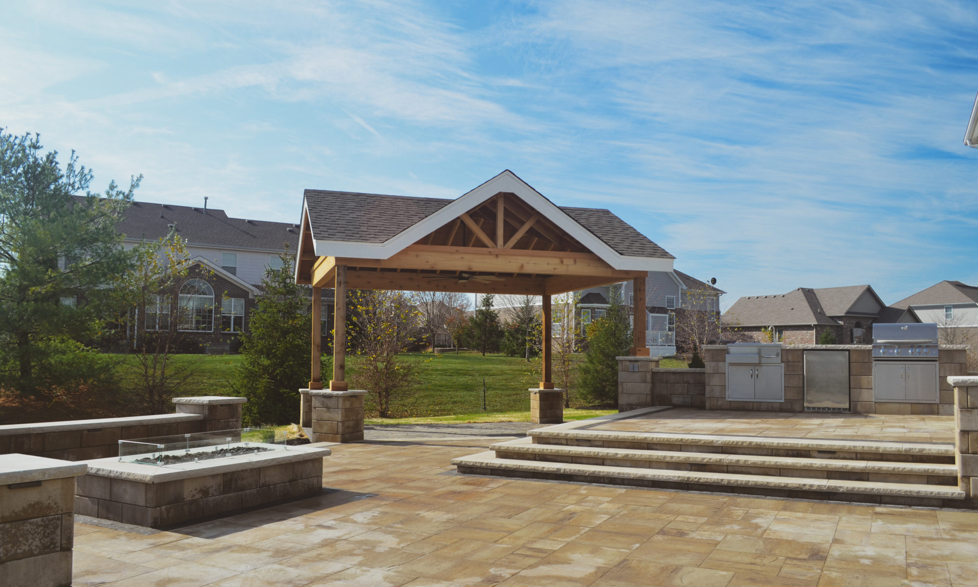 Gables at Hickory Stick Greenwood Bargersville Indiana Paver Patio Gas burning fire pit exterior build dream backyard gable roof structure walkway custom custom landscaping outdoor kitchen mini fridge mini refrigerator fan lighting grill