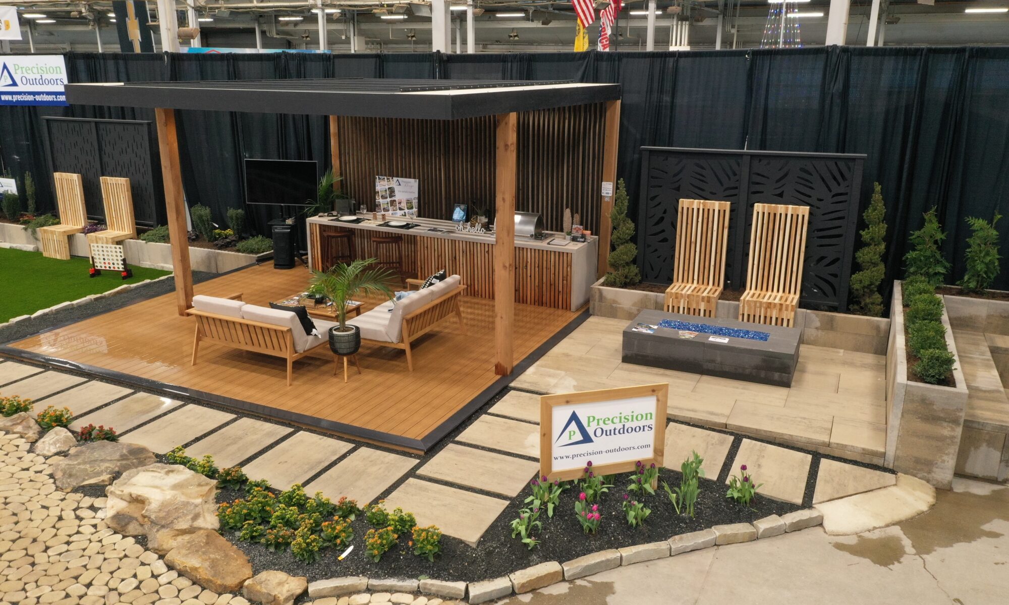 Precision Outdoors Flower and patio show 2023 indianapolis exterior build backyard goals dream backyard the smart pergola belgard plants shrubs tree water features bridge rock pavers paver fire pit lawn games connect four giant jingo astroturf astro turf traditional pergola modern pergola honeycomb tile checkers corn hole precision stone walkway inground in ground trampoline wooden playhouse woodman playhouses custom outdoor pitching dining cedar fountain beautiful display boulders boulder private privacy screen screens cozy entertainment entertaining precision design services