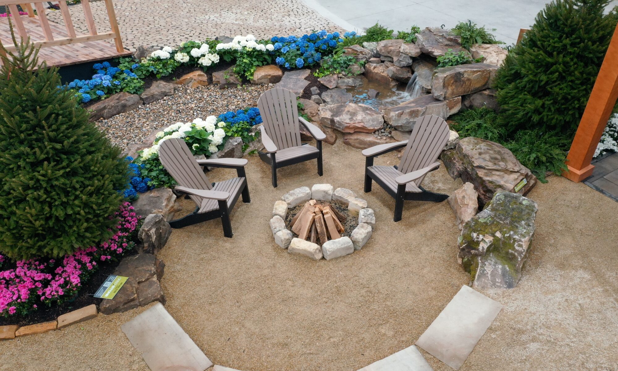 Precision Outdoors Flower and patio show 2023 indianapolis exterior build backyard goals dream backyard the smart pergola belgard plants shrubs tree water features bridge rock pavers paver fire pit lawn games connect four giant jingo astroturf astro turf traditional pergola modern pergola honeycomb tile checkers corn hole precision stone walkway inground in ground trampoline wooden playhouse woodman playhouses custom outdoor pitching dining cedar fountain beautiful display boulders boulder private privacy screen screens cozy entertainment entertaining precision design services