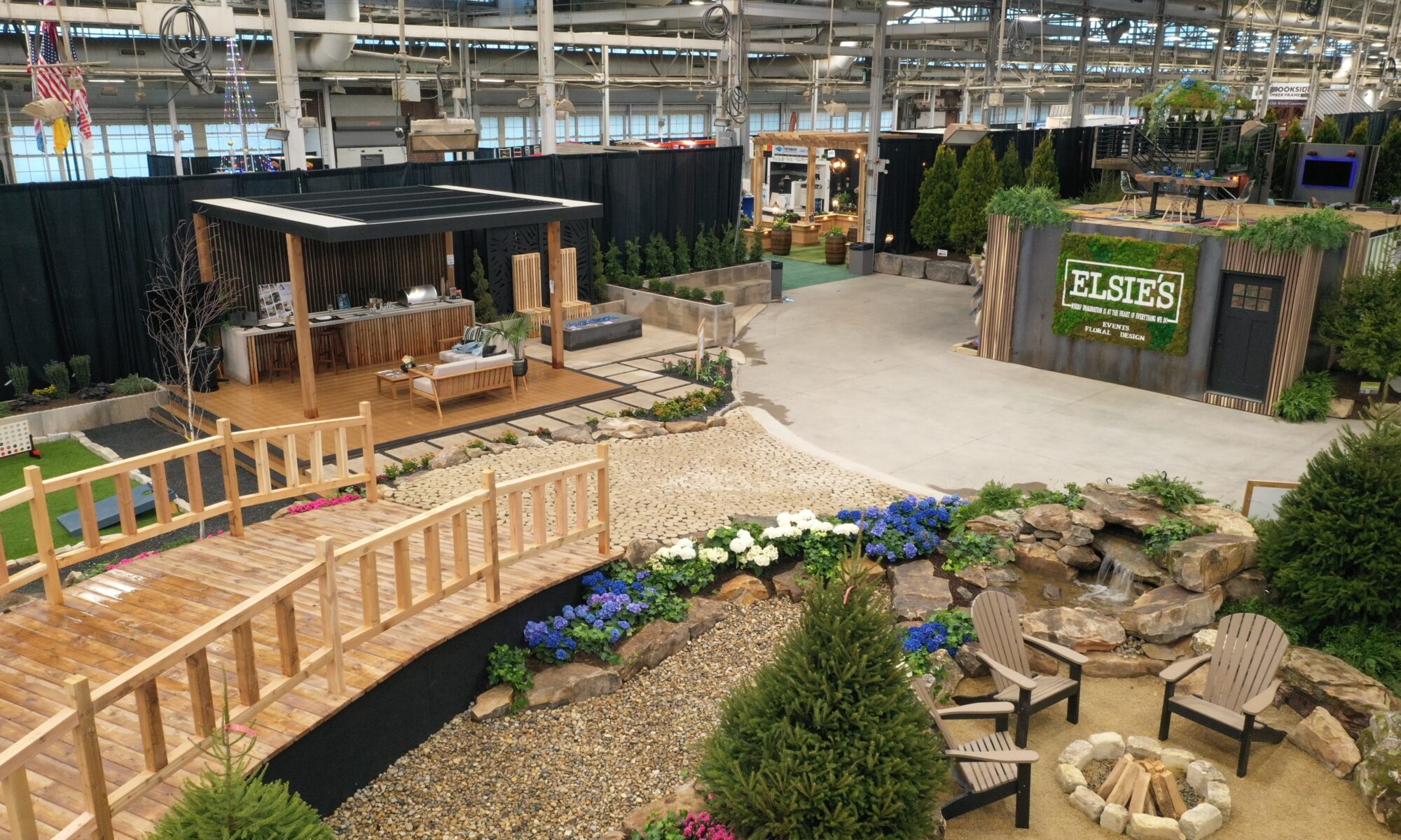 Precision Outdoors Flower and patio show 2023 indianapolis exterior build backyard goals dream backyard the smart pergola belgard plants shrubs tree water features bridge rock pavers paver fire pit lawn games connect four giant jingo astroturf astro turf traditional pergola modern pergola honeycomb tile checkers corn hole precision stone walkway inground in ground trampoline wooden playhouse woodman playhouses custom outdoor pitching dining cedar fountain beautiful display boulders boulder private privacy screen screens cozy entertainment entertaining precision design services