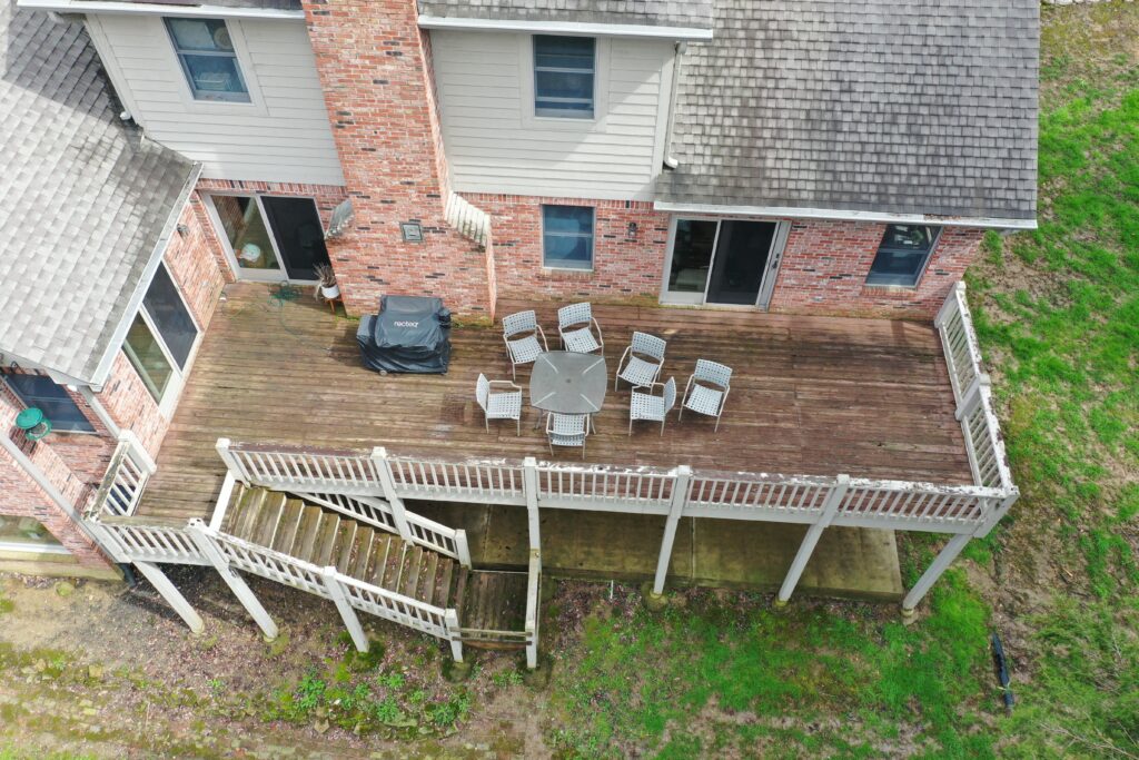 precision outdoors Bargersville elevated Exterior backyard remodel Trex composite decking concrete patio hot tub backyard goals dream backyard screened in porch outdoor living space dining area indiana exterior design relaxing outdoors tongue and groove ceiling modern cable railing custom rock landscaping walkway