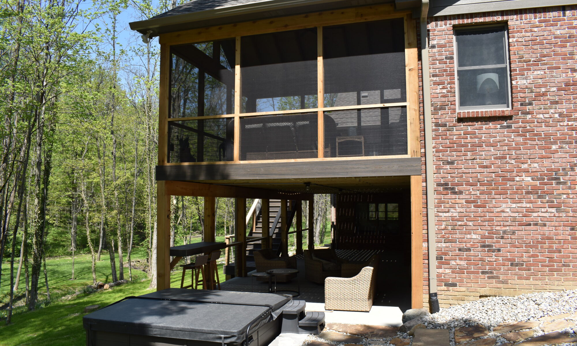 precision outdoors Bargersville elevated Exterior backyard remodel Trex composite decking concrete patio hot tub backyard goals dream backyard screened in porch outdoor living space dining area indiana exterior design relaxing outdoors tongue and groove ceiling modern cable railing custom rock landscaping walkway