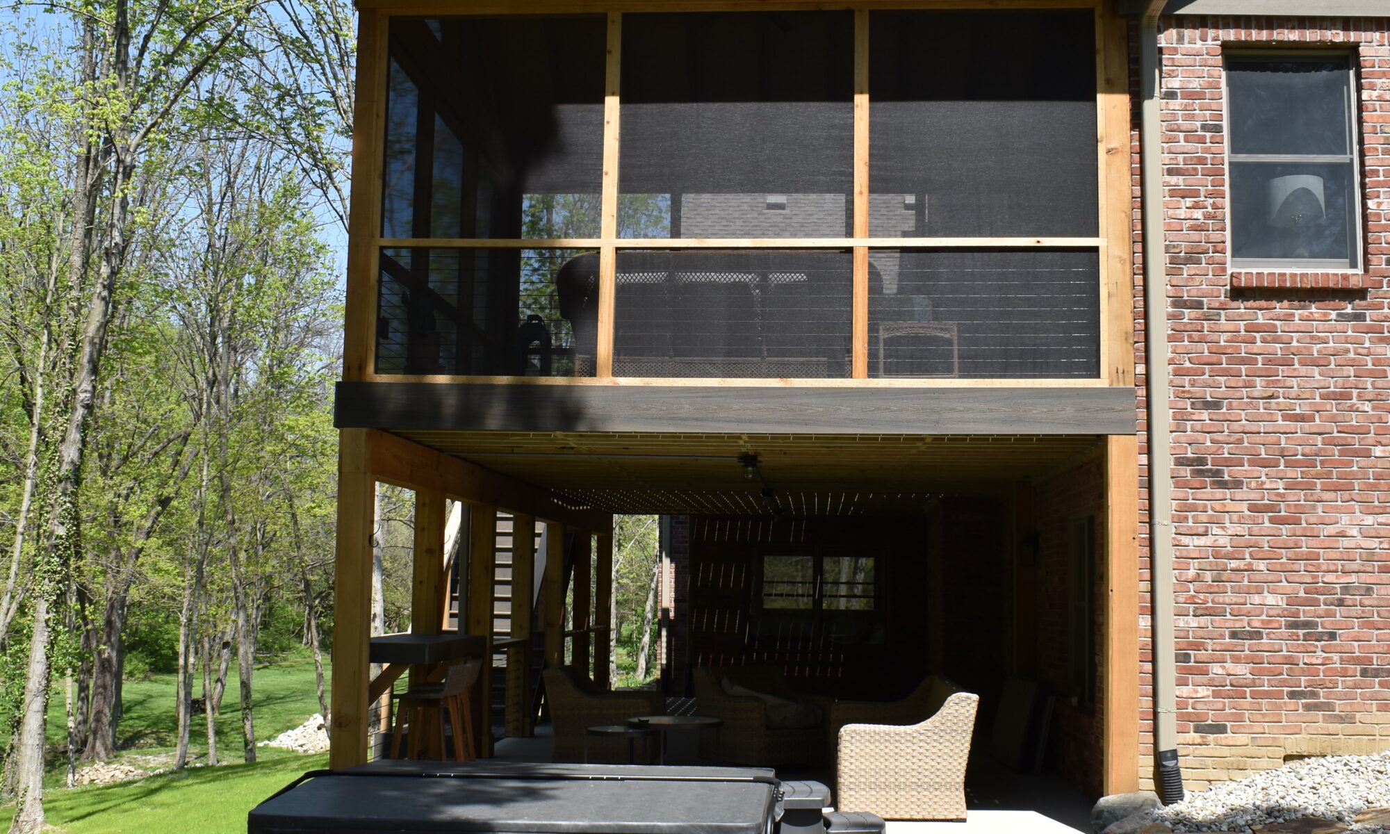 precision outdoors Bargersville elevated Exterior backyard remodel Trex composite decking concrete patio hot tub backyard goals dream backyard screened in porch outdoor living space dining area indiana exterior design relaxing outdoors tongue and groove ceiling modern cable railing custom rock landscaping walkway