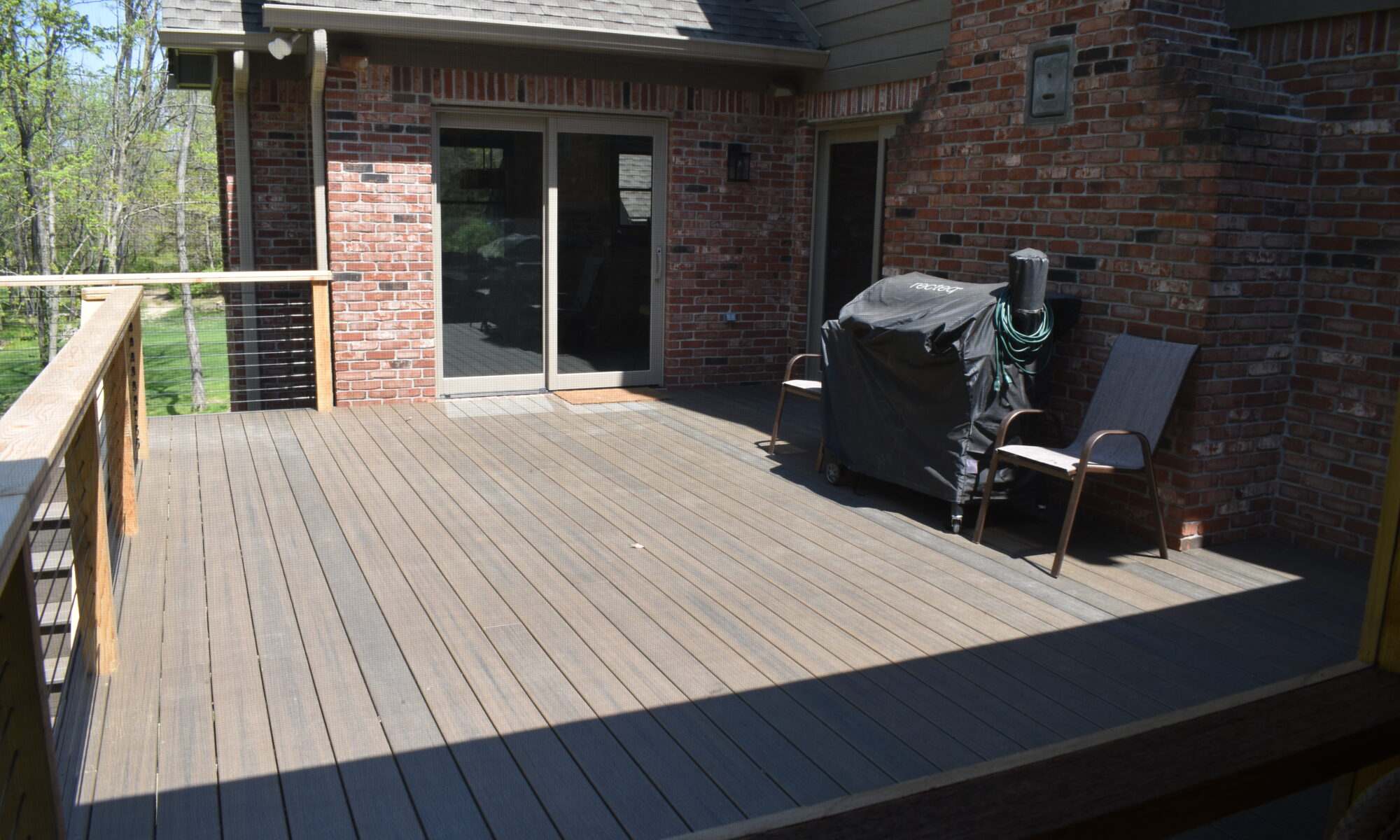 precision outdoors Bargersville elevated Exterior backyard remodel Trex composite decking concrete patio hot tub backyard goals dream backyard screened in porch outdoor living space dining area indiana exterior design relaxing outdoors tongue and groove ceiling modern cable railing custom rock landscaping walkway