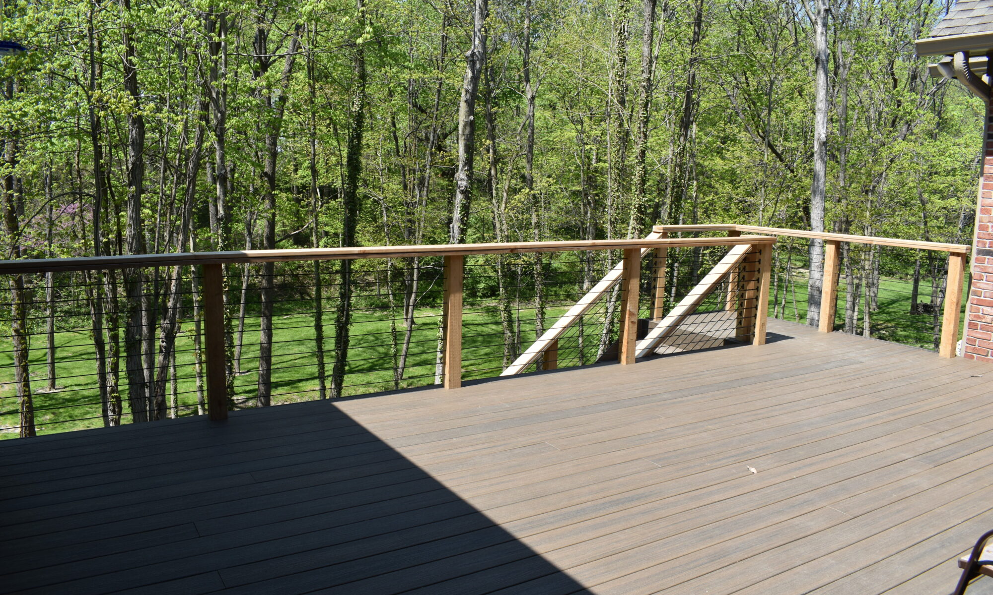 precision outdoors Bargersville elevated Exterior backyard remodel Trex composite decking concrete patio hot tub backyard goals dream backyard screened in porch outdoor living space dining area indiana exterior design relaxing outdoors tongue and groove ceiling modern cable railing custom rock landscaping walkway