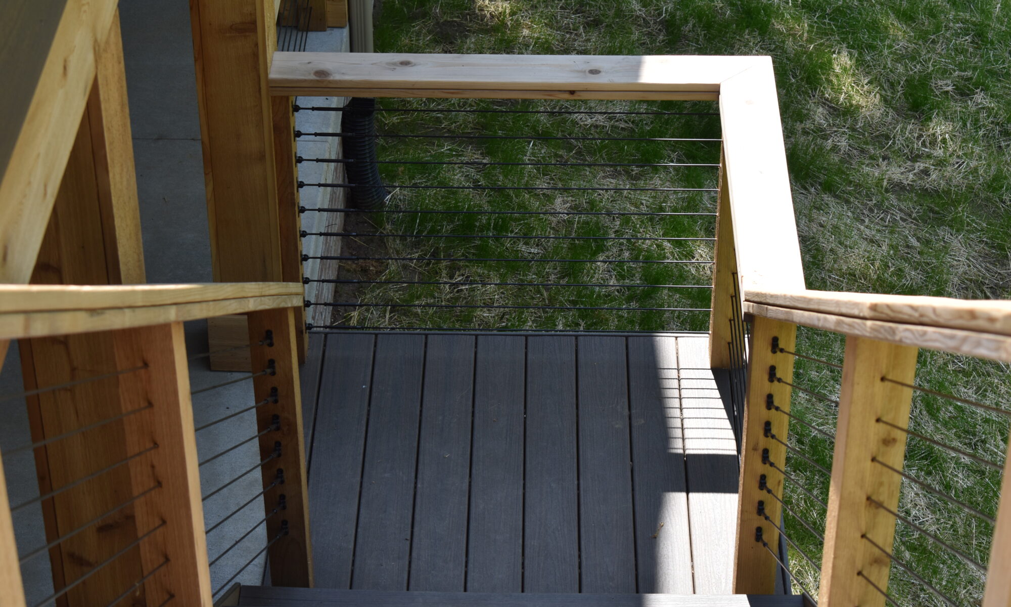 precision outdoors Bargersville elevated Exterior backyard remodel Trex composite decking concrete patio hot tub backyard goals dream backyard screened in porch outdoor living space dining area indiana exterior design relaxing outdoors tongue and groove ceiling modern cable railing custom rock landscaping walkway