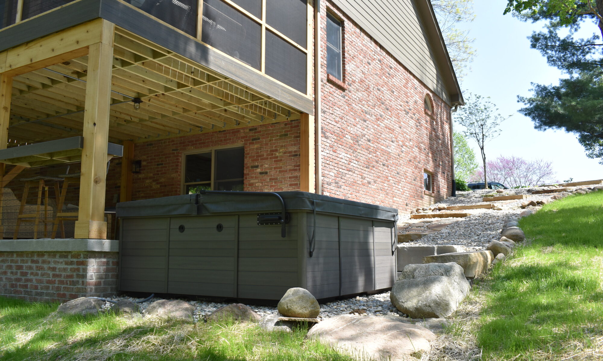 precision outdoors Bargersville elevated Exterior backyard remodel Trex composite decking concrete patio hot tub backyard goals dream backyard screened in porch outdoor living space dining area indiana exterior design relaxing outdoors tongue and groove ceiling modern cable railing custom rock landscaping walkway