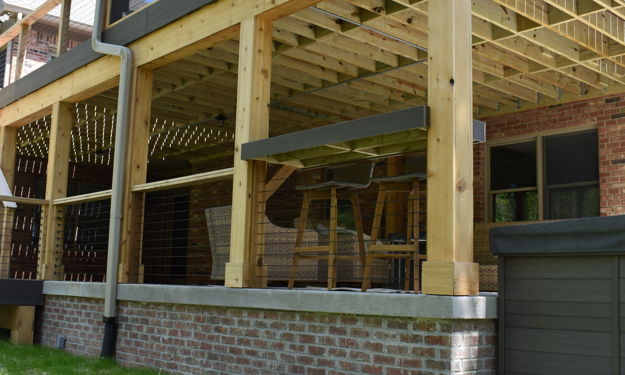 precision outdoors Bargersville elevated Exterior backyard remodel Trex composite decking concrete patio hot tub backyard goals dream backyard screened in porch outdoor living space dining area indiana exterior design relaxing outdoors tongue and groove ceiling modern cable railing custom rock landscaping walkway