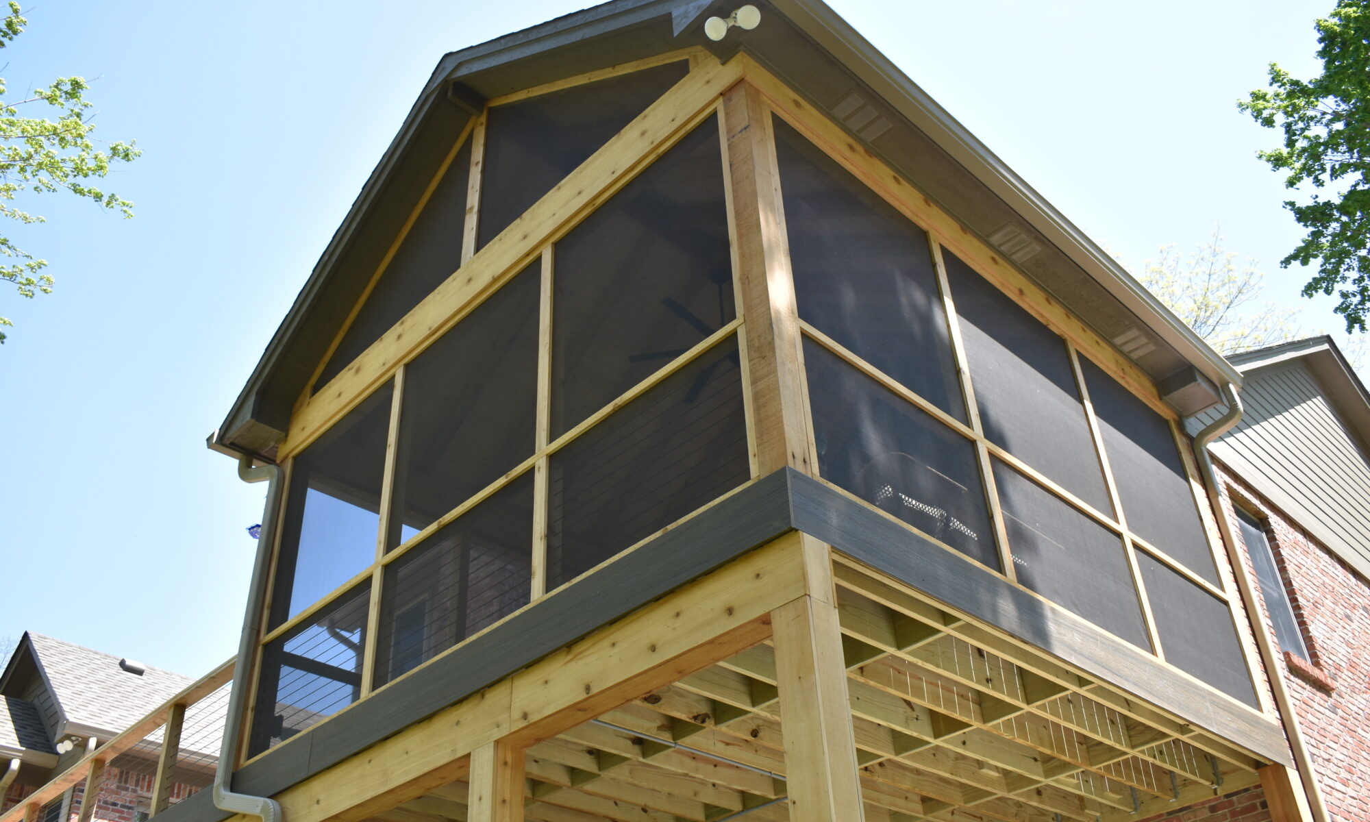 precision outdoors Bargersville elevated Exterior backyard remodel Trex composite decking concrete patio hot tub backyard goals dream backyard screened in porch outdoor living space dining area indiana exterior design relaxing outdoors tongue and groove ceiling modern cable railing custom rock landscaping walkway
