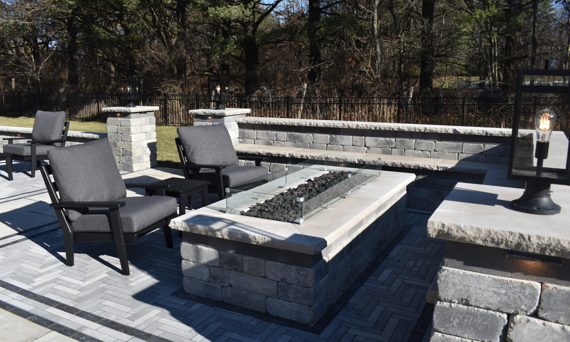 Precision Outdoors Peck Patio Carmel Indiana Unilock Mattoni Granite fusion Copthorn Basalt Old quarry granite line graphite black river limestone coping cap Belgard Outdoor Living Belgard Dimensions slab cheswick runner herringbone paver patio pattern custom concrete walkway seating wall gas fire pit lighting custom landscaping sod backyard entertaining outdoor fire place glass windshield