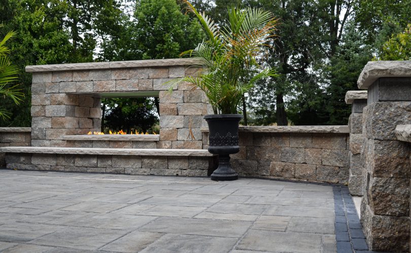 Precision Outdoors Greenwood Fireplace & patio custom paver patio secluded gathering space backyard dual fireplace gathering landscaping, mulching, straw and seed placement seeding unilock materials Greenwood indiana dream space