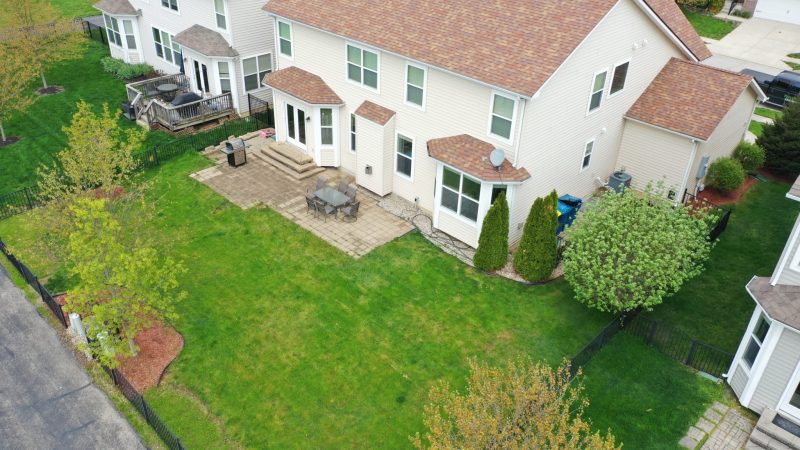 Precision Outdoors Tranquil Lochaven Noblesville Indiana gable roof structure outdoor kitchen water feature water fountain outdoor heater outdoor dining gas fire bowl fire pit hot tub privacy screen paver walkway stone walkway walking path peaceful backyard entertaining space planter box