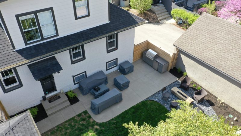 Precision Outdoors Indianapolis The Ritzy Skillion Pergola updated fire pit area concrete patio water feature fountain grill space landscaping outdoor dining