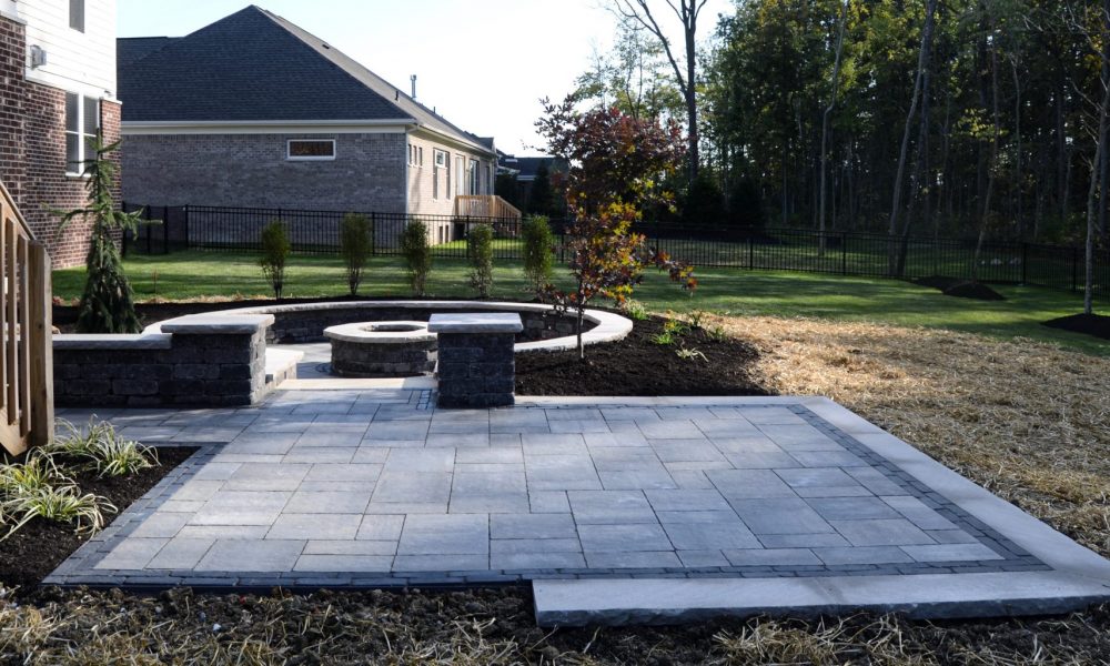 Zionsville Fire Pit & Patio Precision Outdoors Zionsville Fire Pit & Patio custom paver patio gathering space backyard sunken fire pit landscaping mulching straw and seed placement unblock Bristol valley steel mountain Copthorne accents seating wall belgard round fire pit Firepit Weston wall rock face limestone caps zionsville indiana privacy