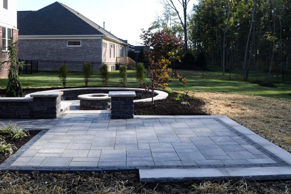 Zionsville Fire Pit & Patio Precision Outdoors Zionsville Fire Pit & Patio custom paver patio gathering space backyard sunken fire pit landscaping mulching straw and seed placement unblock Bristol valley steel mountain Copthorne accents seating wall belgard round fire pit Firepit Weston wall rock face limestone caps zionsville indiana privacy